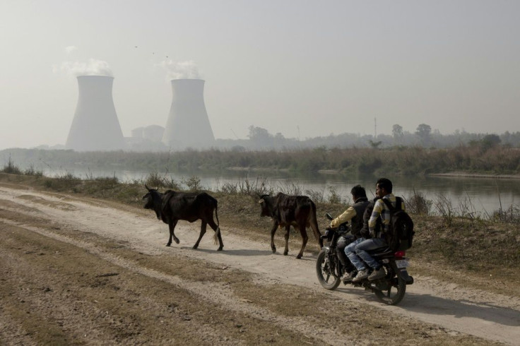 Men ride near a nuclear plant in Uttar Pradesh state. Plans for another one in western India faced opposition from local inhabitants since the idea was first floated around 20 years ago, and was delayed after the 2011 nuclear disaster in Fukushima, Japan.