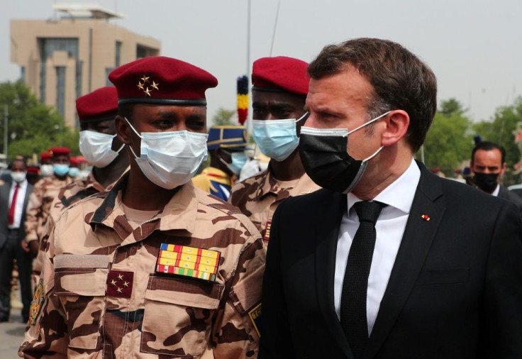 French President Emmanuel Macron, right, and the son of the late Chadian president Idriss Deby Itno, Mahamat Idriss Deby