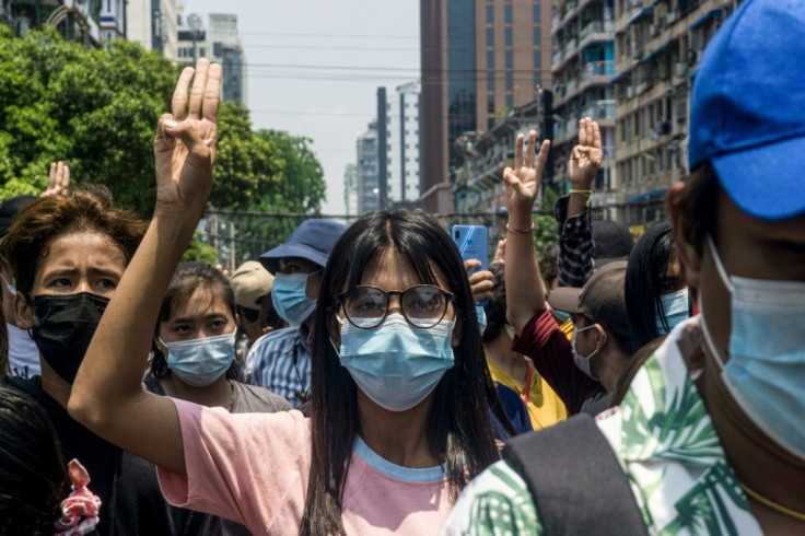 Yangon protesters returned to the streets, flashing three-finger salutes