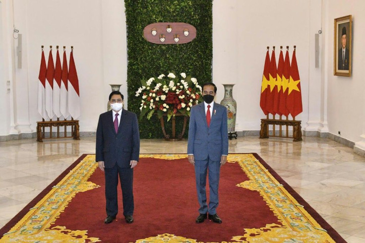 Indonesian President Joko Widodo (right) and Vietnam's Prime Minister Pham Minh Chinh at the Presidential Palace in Jakarta ahead of the ASEAN summit