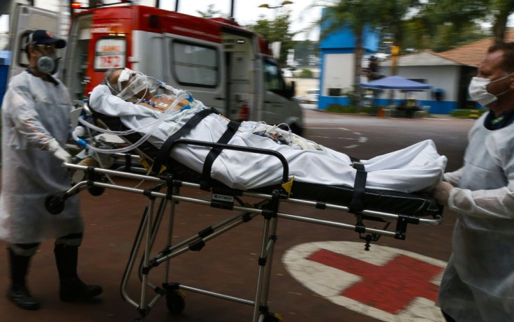A Covid patient arrives by ambulance at a hospital set up in a sports gym, in Santo Andre, Sao Paulo state, on March 26, 2021