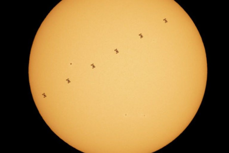 A composite image made from six frames shows the International Space Station in silhouette as it transits the sun at roughly five miles per second on April 23, 2021, as seen from Nottingham, Maryland