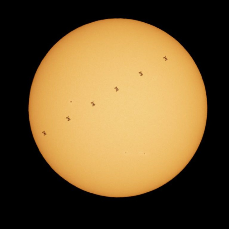 A composite image made from six frames shows the International Space Station in silhouette as it transits the sun at roughly five miles per second on April 23, 2021, as seen from Nottingham, Maryland