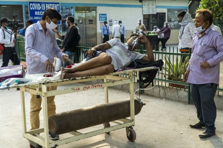 India's surge has seen it add about 350,000 cases and 2,600 deaths a day, and the healthcare system has been pushed to breaking point