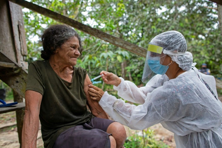 Maria Ferreira, 74, gets an AstraZeneca vaccine on February 9, 2021 near Manaus