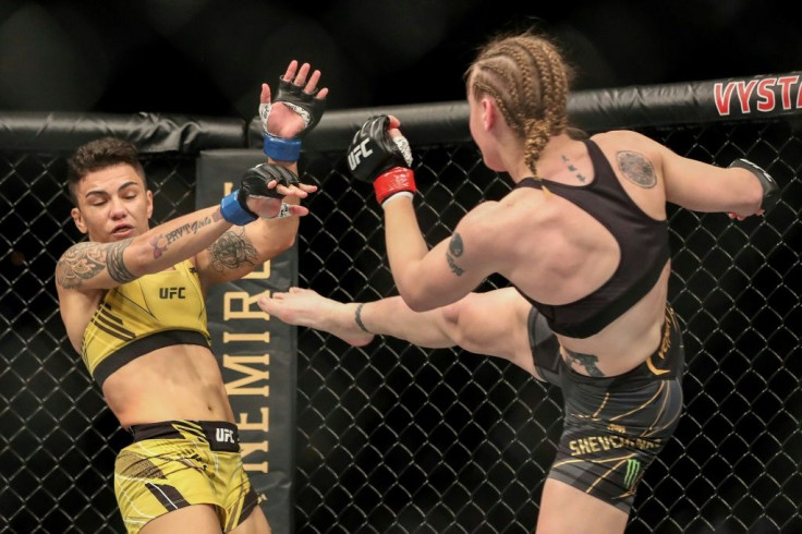 The first of the three title fights on the card saw Shevchenko of Kyrgyzstan use her superior strength and a nine centimeter height advantage to overpower Brazilian challenger Jessica Andrade