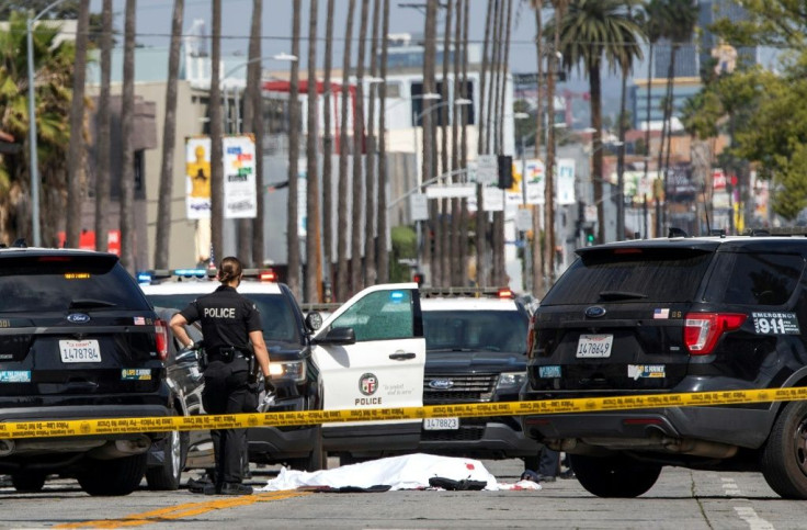Police said they shot dead a man wearing body armor who reversed into a patrol car on Sunset Boulevard