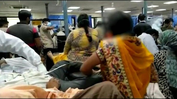 Images show an overcrowded Covid-19 ward inside a New Delhi hospital where two or three patients share a single bed, with barely enough space for others to stand. India's daily coronavirus death toll has set a new record and the government is battling to 