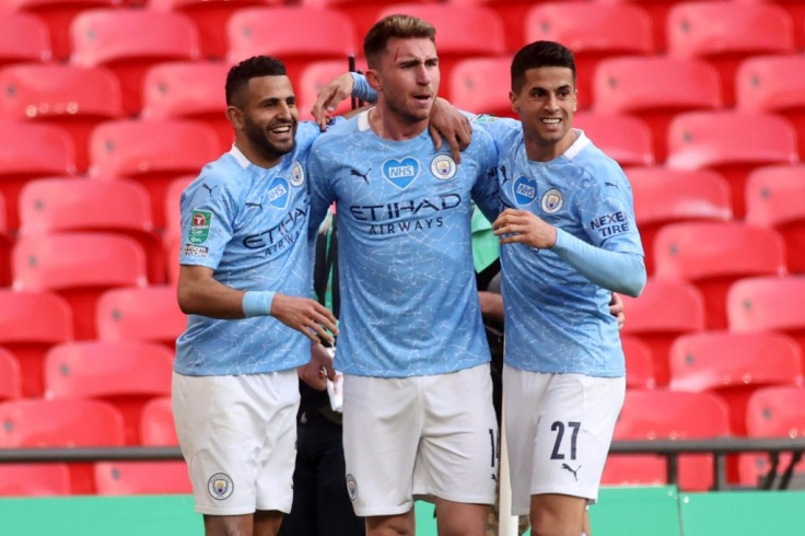 Aymeric Laporte (centre) scored the only goal as Manchester City beat Tottenham 1-0 to retain the League Cup