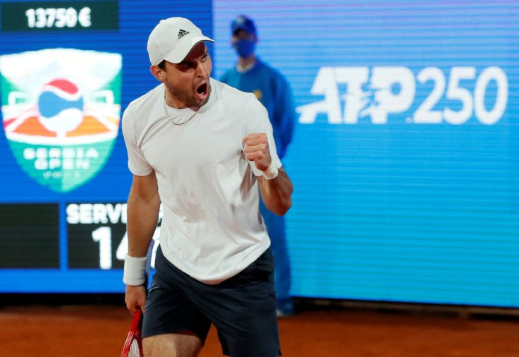 Over the 'wall': Russia's Aslan Karatsev celebrates after beating Novak Djokovic