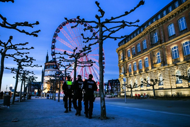 Police officers patrol on the Rhine promenade during heightened Covid-19 restrictions in Duesseldorf, Germany