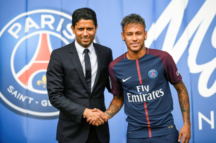 Neymar (right) shakes hands with Paris Saint Germain's Qatari president Nasser Al-Khelaifi (left)after his world record 222 million euro move from Barcelona in 2017