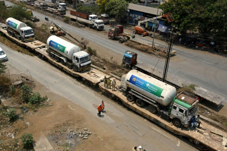 Oxygen tankers arrive at a goods yard in Mumbai