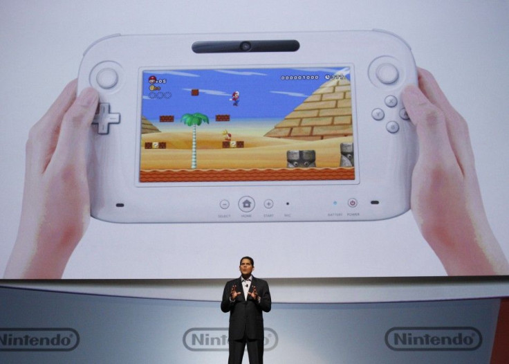 Fils-Aim, president of Nintendo of America, presents the new Wii U controller at a media briefing during the Electronic Entertainment Expo, or E3, in Los Angeles