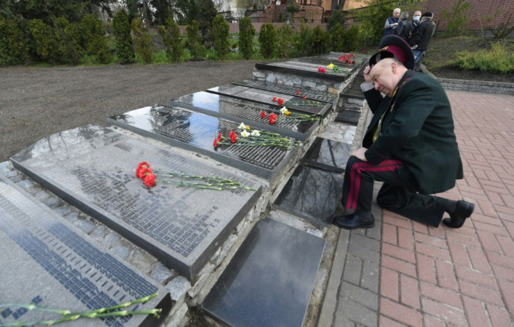 In Kiev, religious leaders and elderly veterans in military uniform involved in clean up efforts after the disaster placed flowers at a memorial