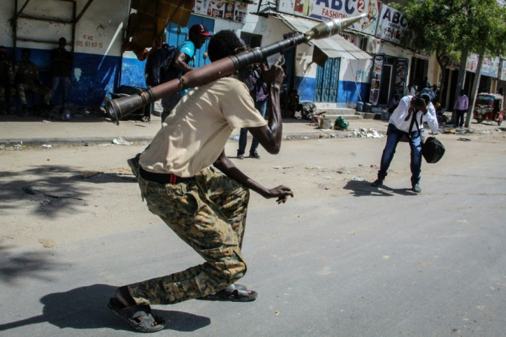 Fighters used mounds of earth to barricade roads, while armed men and vehicles mounted with machine guns were stationed in opposition strongholds.