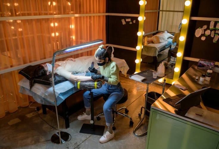 Tattoo artist Marissa Boulay gives Abigail Glasgow an ephemeral tattoo in New York