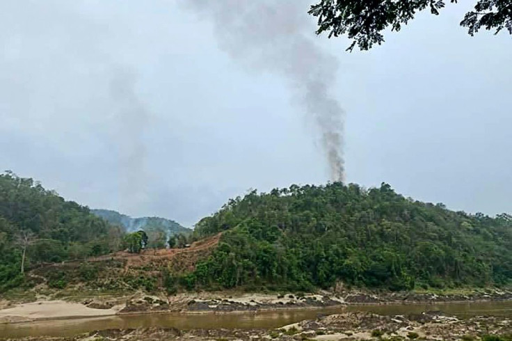 Smoke rises from a Myanmar military base, as seen from Mae Sam Laep in Thailand, after the base was captured by the Karen National Union