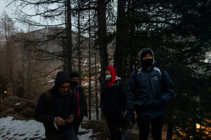 Some people give up trying to get across the mountains, and are taken back to the refuge by Red Cross volunteers