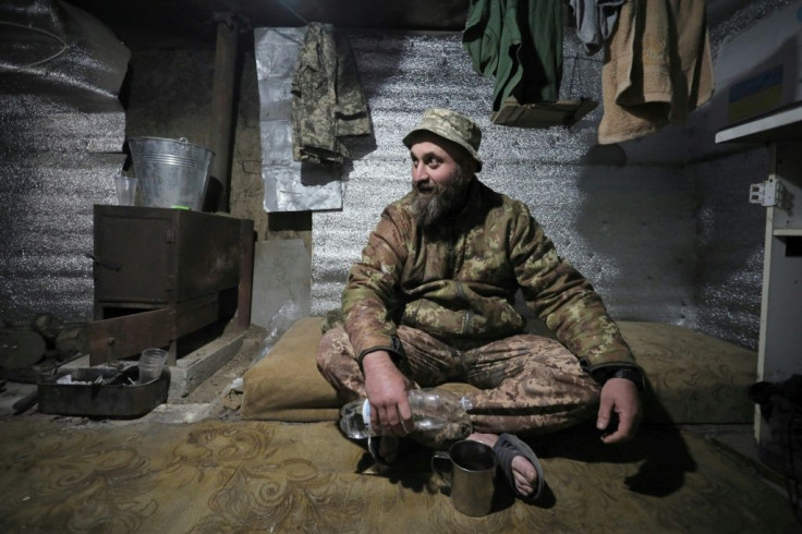 Gotcha, a Ukrainian soldier of Georgian origin, rests in a dugout in the village of Shyrokyne