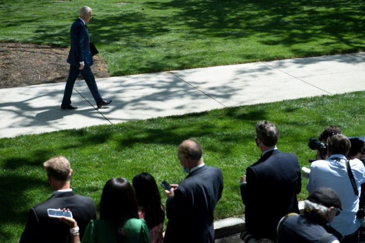 US President Joe Biden leaves after speaking about updated CDC guidance on masks