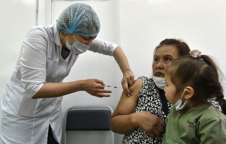 A patient receives a dose of Russia's Sputnik V Covid-19 vaccine in Bishkek