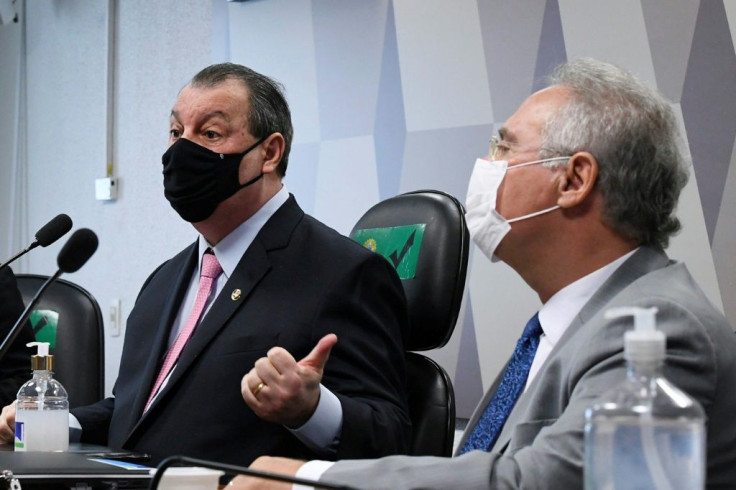 Senators Omar Aziz (L) and Renan Calheiros, chairman and rapporteur respectively, participate in the parliamentary inquiry commission on April 27, 2021