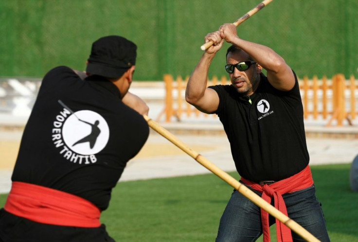 Youths take part in a training session of Egypt's combative sport of 'tahtib' (stick-fighting), in the capital Cairo