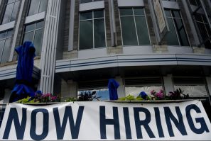 New filings for US unemployment aid dropped for the third straight week to a new pandemic low, indicating businesses may finally be recovering from the mass layoffs that began in March 2020