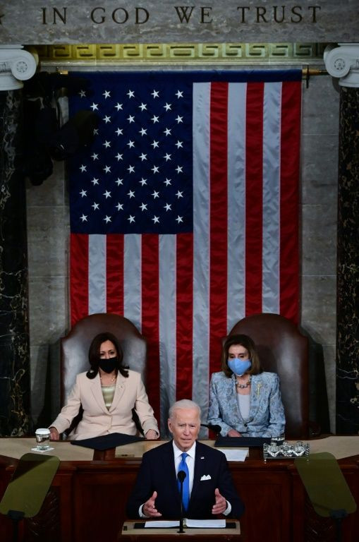 US President Joe Biden said the country "is on the move again" and urged Americans to get vaccinated so life can return to normal