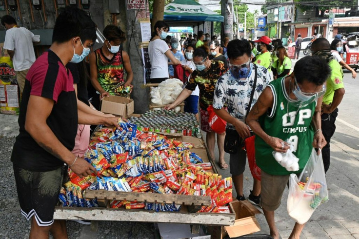Community-run stalls offer free food to Filipinos struggling to feed their families as virus lockdowns have thrown thousands out of work