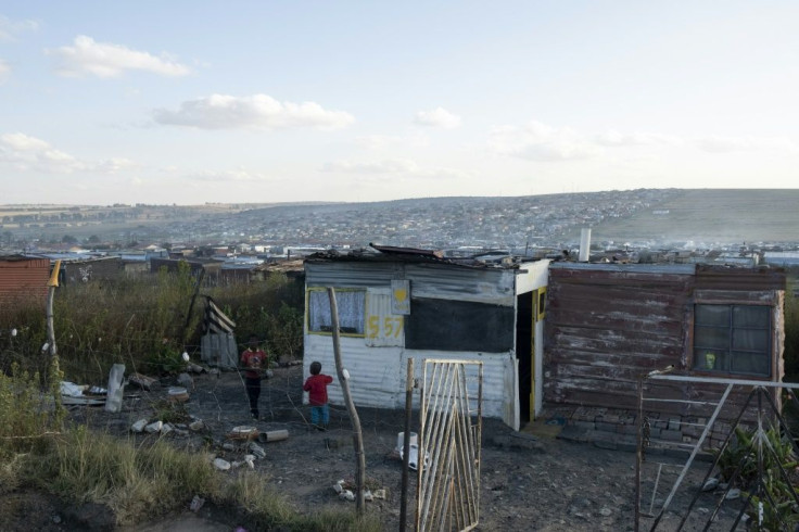 People in the townships live in makeshift shacks where coal is the only source of energy