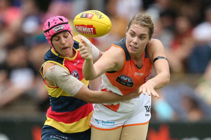Heather Anderson of the Crows tackles Jacinda Barclay of the Giants 