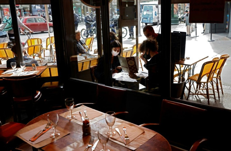 In France, cafes, cultural venues and business will reopen in several phases from next month, President Emmanuel Macron said