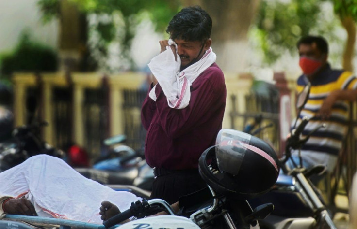 India recorded another 385,000 new cases in the past 24 hours -- a new global record deaths, according to official data