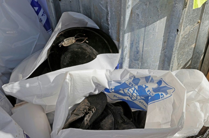 Shoes and hats are seen in bags at the site of a stampede during the Jewish pilgrimage