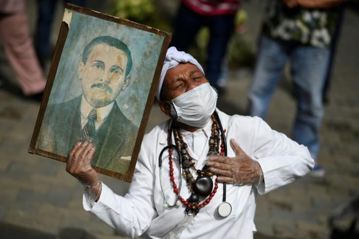 The faithful gathered outside a church in the neighborhood of La Candelaria, where Hernandez's remains were held until last year, when they were exhumed for the beatification