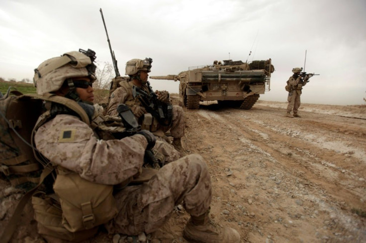 In this file photo taken on February 21, 2010, US Marines clear Improvised Explosive Devices from a main route in Trikh Nawar on the North Eastern outskirts of Marjah
