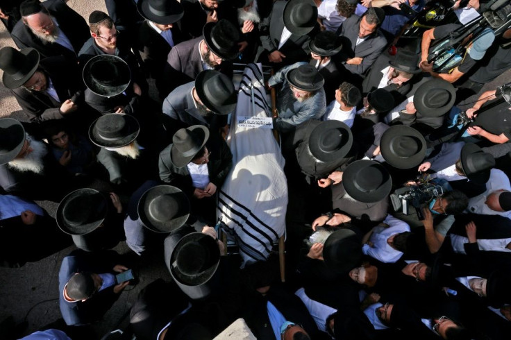 Ultra-Orthodox Jewish men attend the Jerusalem funeral of one of the stampede victims