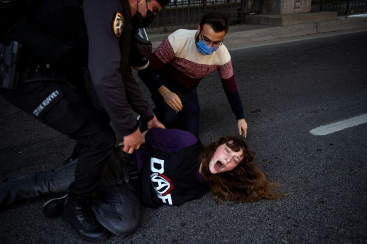 Turkish police detain a woman trying to protest in Istanbul on May 1 despite a Covid-related ban on demonstrations