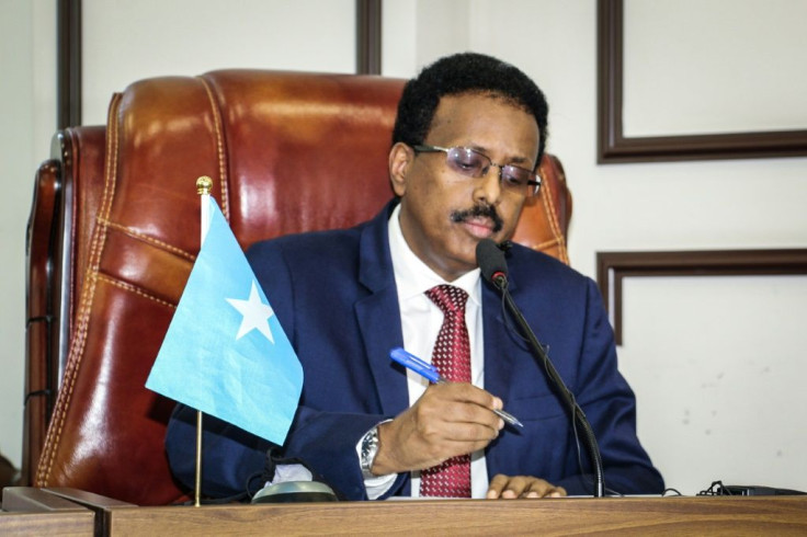 In a brief speech before parliament Somalia's president abandoned a policy extending his term in office by two years