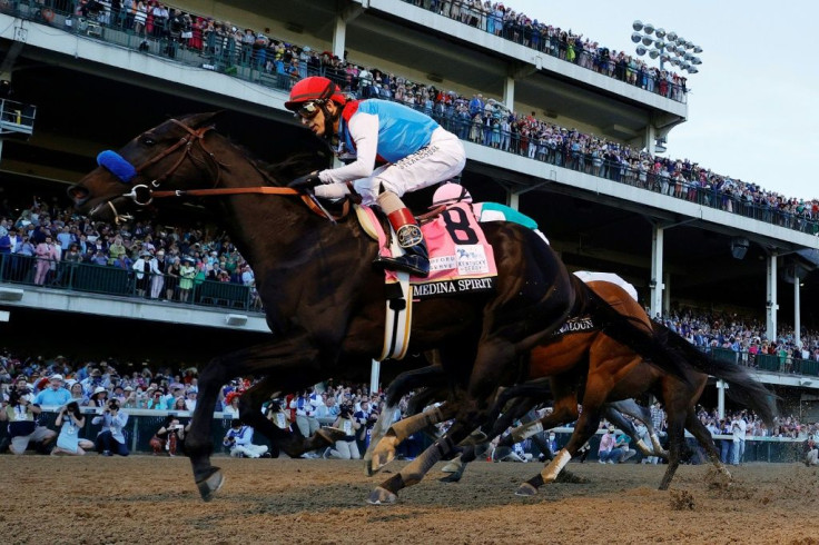 Medina Spirit, ridden by jockey John Velazquez, wins the 147th Kentucky Derby