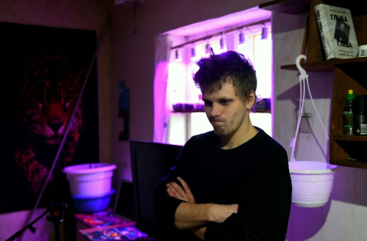 Robert Yudin, 24, was recently called up for military service. His mother blames that on her political activities