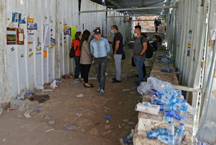 People stand at the scene of a stampede during a religious gathering near the tomb of Rabbi Shimon Bar Yochai, a second-century Talmudic sage