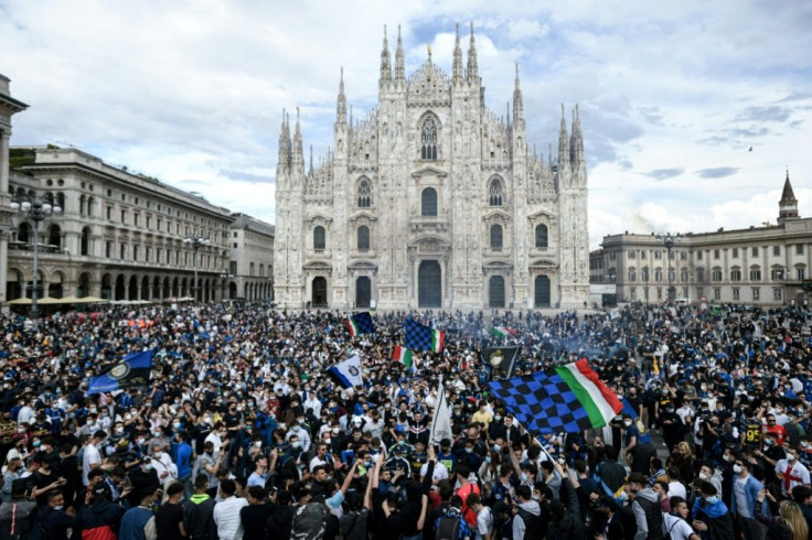 Inter fans celebrate their first Serie A title in 11 years at Piazza Duomo in Milan