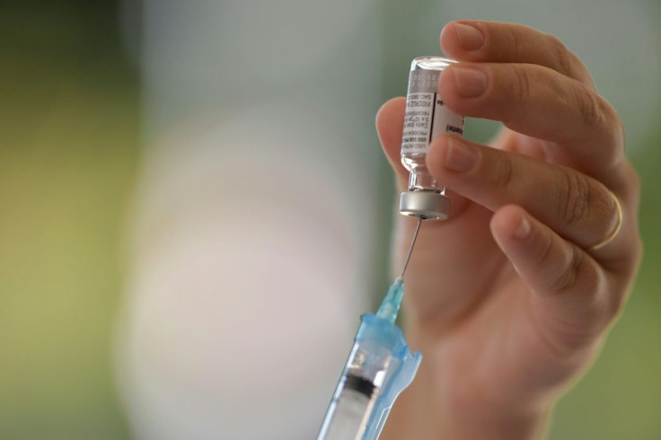 A member of the Brazilian Army prepares an AstraZeneca/Oxford vaccine in Belo Horizonte, where authorities suspended administration of second doses of inoculations against Covid-19