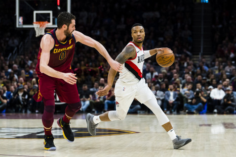 Kevin Love #0 of the Cleveland Cavaliers guards Damian Lillard #0 of the Portland Trail Blazers