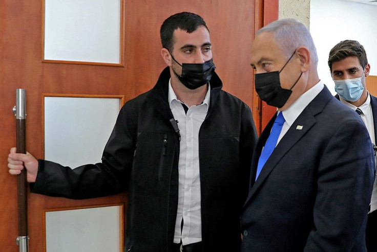 Israeli Prime Minister Benjamin Netanyahu, who is seen here leaving court last month after a hearing in his corruption tiral, faces a midnight deadline to form a government after an inconclusive March election