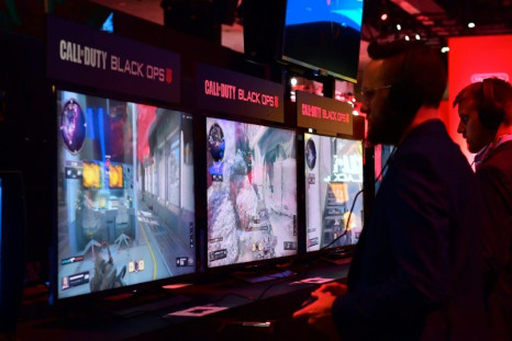 Gamers play the game Call of Duty: Black Ops at the 24th Electronic Expo, or E3 in Los Angeles, California on June 12, 2018