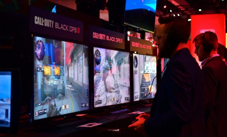Gamers play the game Call of Duty: Black Ops at the 24th Electronic Expo, or E3 in Los Angeles, California on June 12, 2018